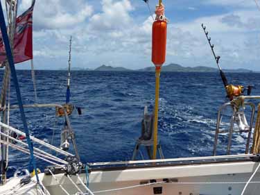 sailboat cruising, trolling rods and reels on Alacazam